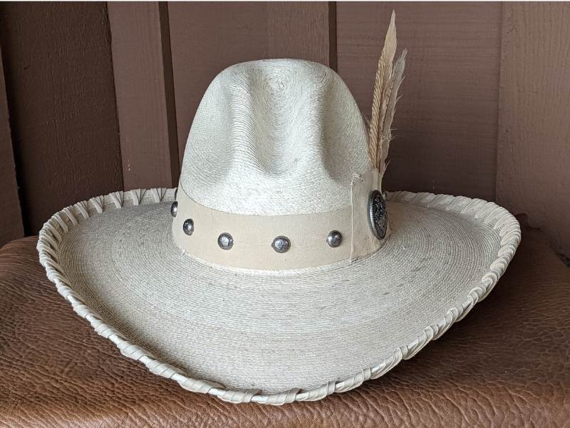 The Blondie Western Cowboy hat features a hat band made from this creamy color deerskin.  It's been laced in buckskin leather and finished with eggshell color pheasant feathers.