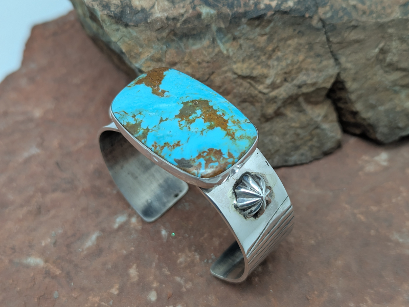 Another view of this one of a kind Kingman Turquoise Sterling Silver Cuff Bracelet - sterling silver berries and etched.